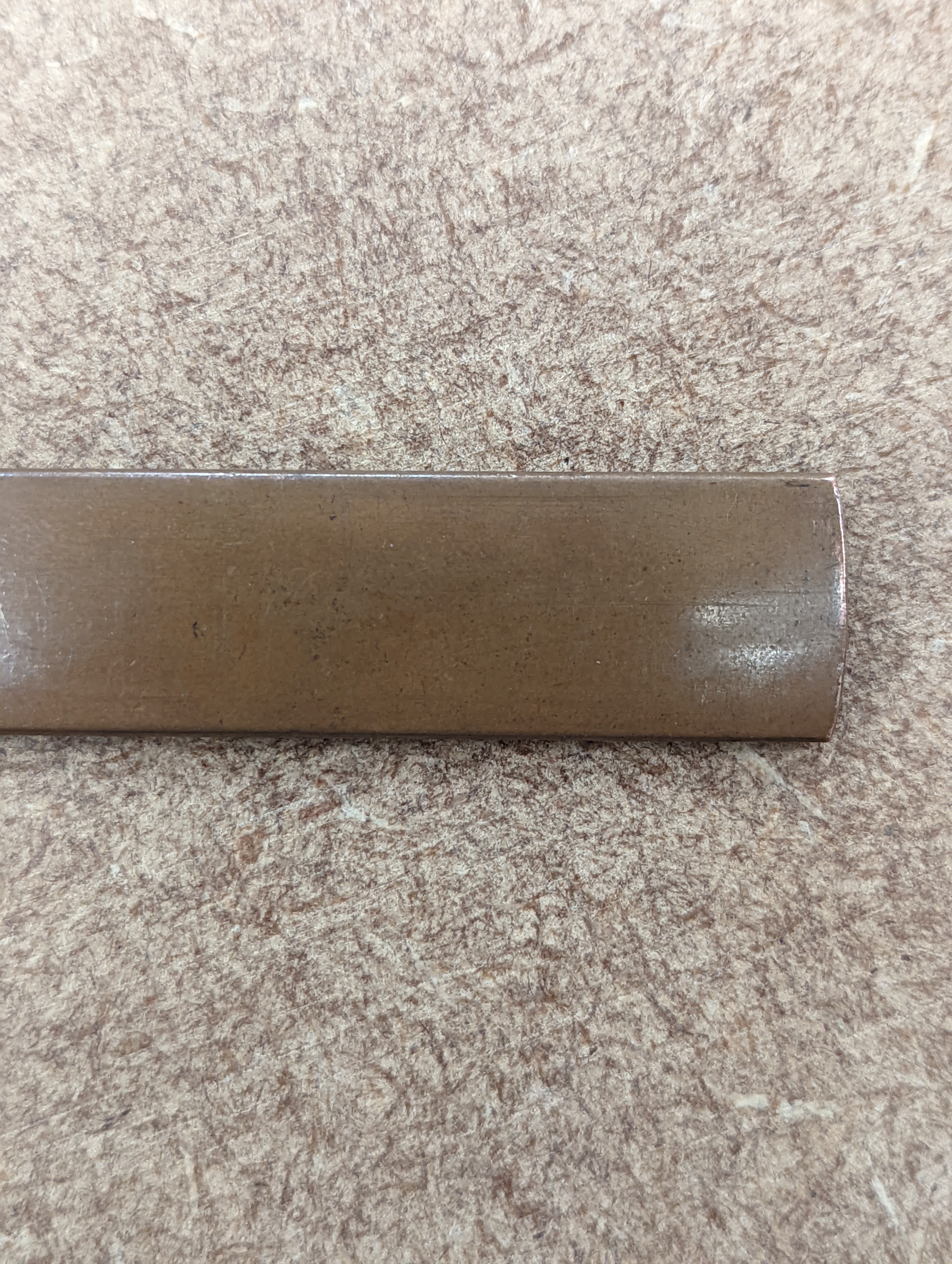 A Japanese mixed metal ‘dragon’ kozuka handle, 19th century, boxed